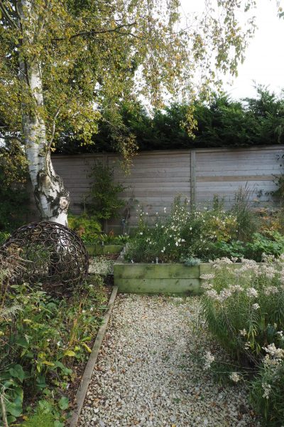 Think about your garden path materials with your walls and fences