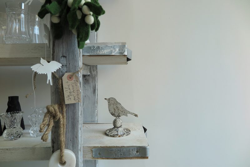 A Christmas theme of birds made of paper, iron or glass.