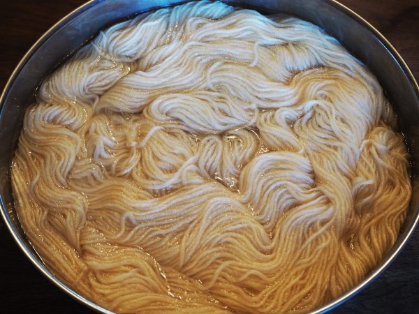 Soak wool or cotton in water before dyeing