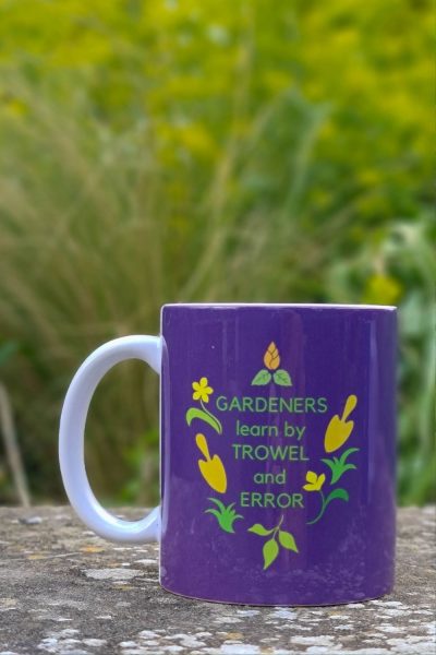 Gardeners Learn by Trowel and Error mug