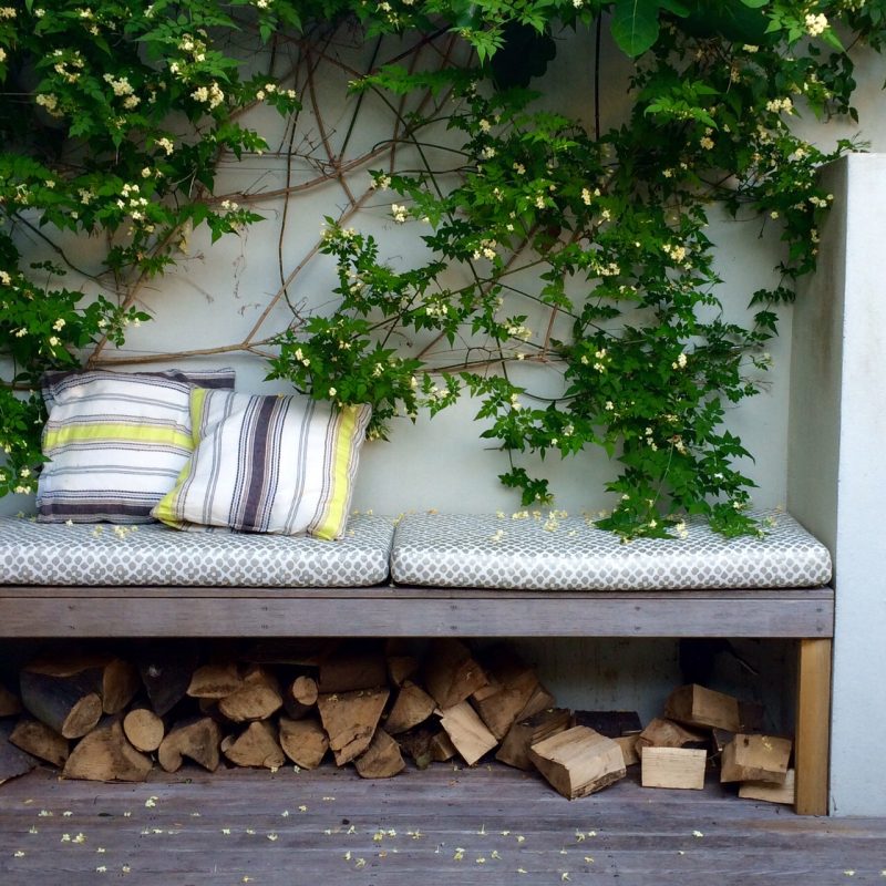 Double up your furniture in a small space - here a built-in bench doubles as a log-store